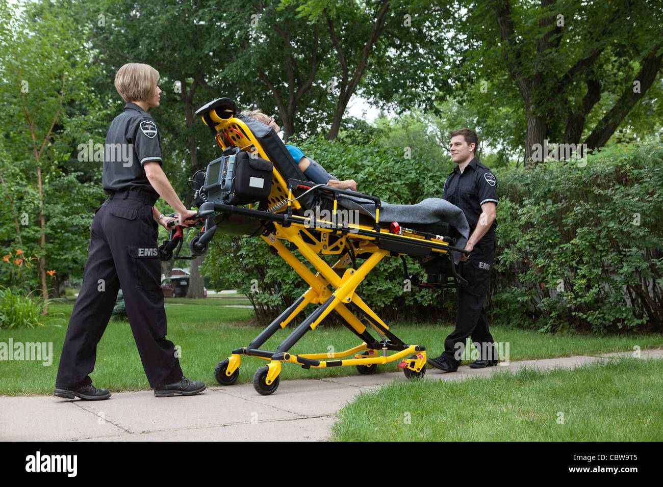 Medical team transporting patient on stretcher Stock Photo Alamy