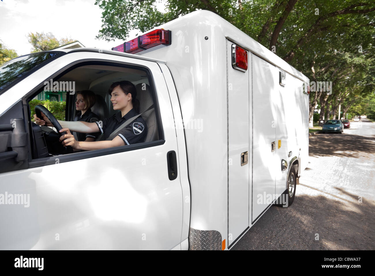 Ambulance driver on an urban street in a city Stock Photo Alamy
