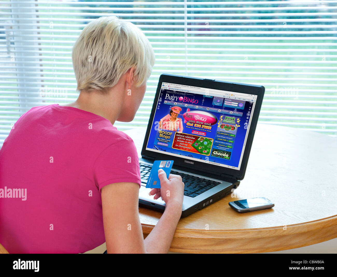woman playing online bingo games on PartyBingo website Stock Photo