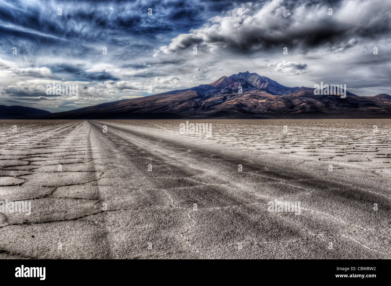 Tracks leading across the alien landscape of the Salar de Uyuni in Bolivia Stock Photo