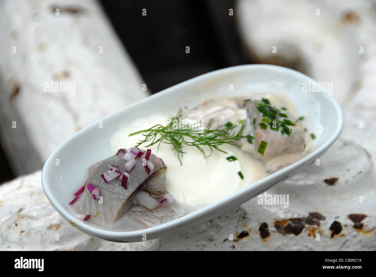 Herring (sild) is served as a starter aboard MS Juno, a vintage steamer cruising Göta Kanal in central Sweden Stock Photo