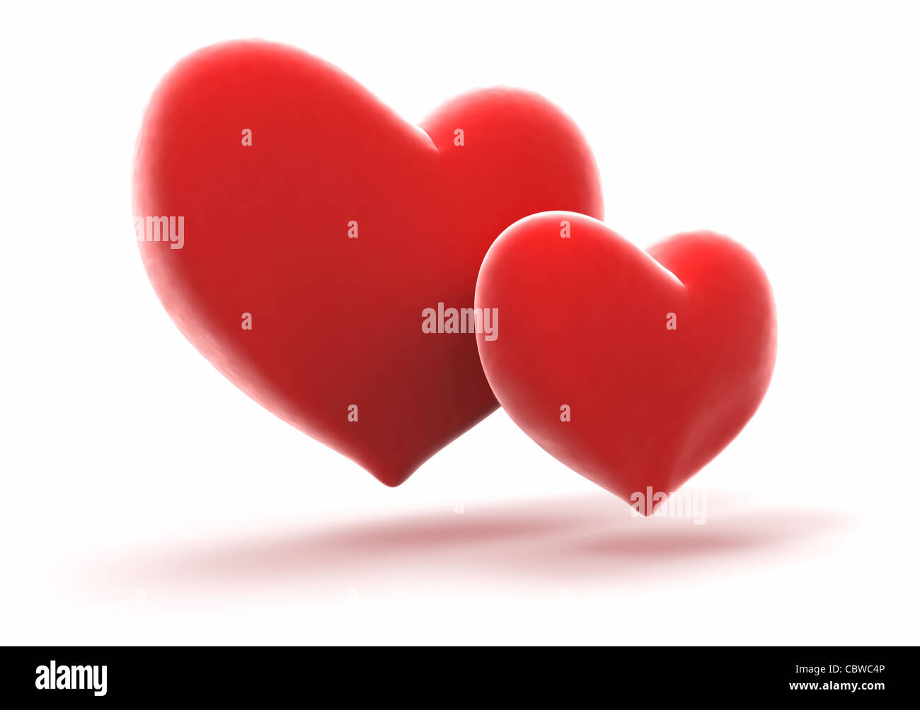 Pair of bright red hearts on white background Stock Photo - Alamy