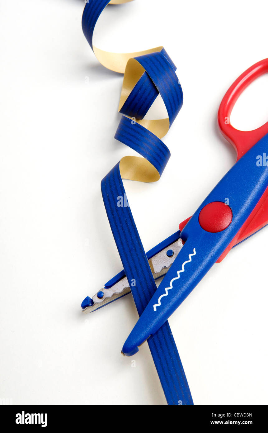 Creative cutting of curling ribbon with scissors for decorations or ...