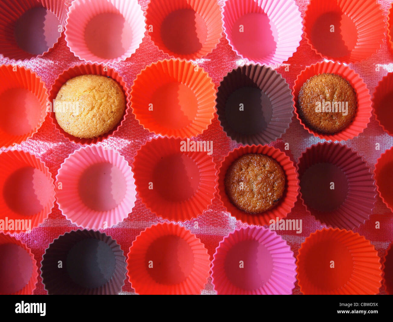 Muffins and empty cake cases Stock Photo