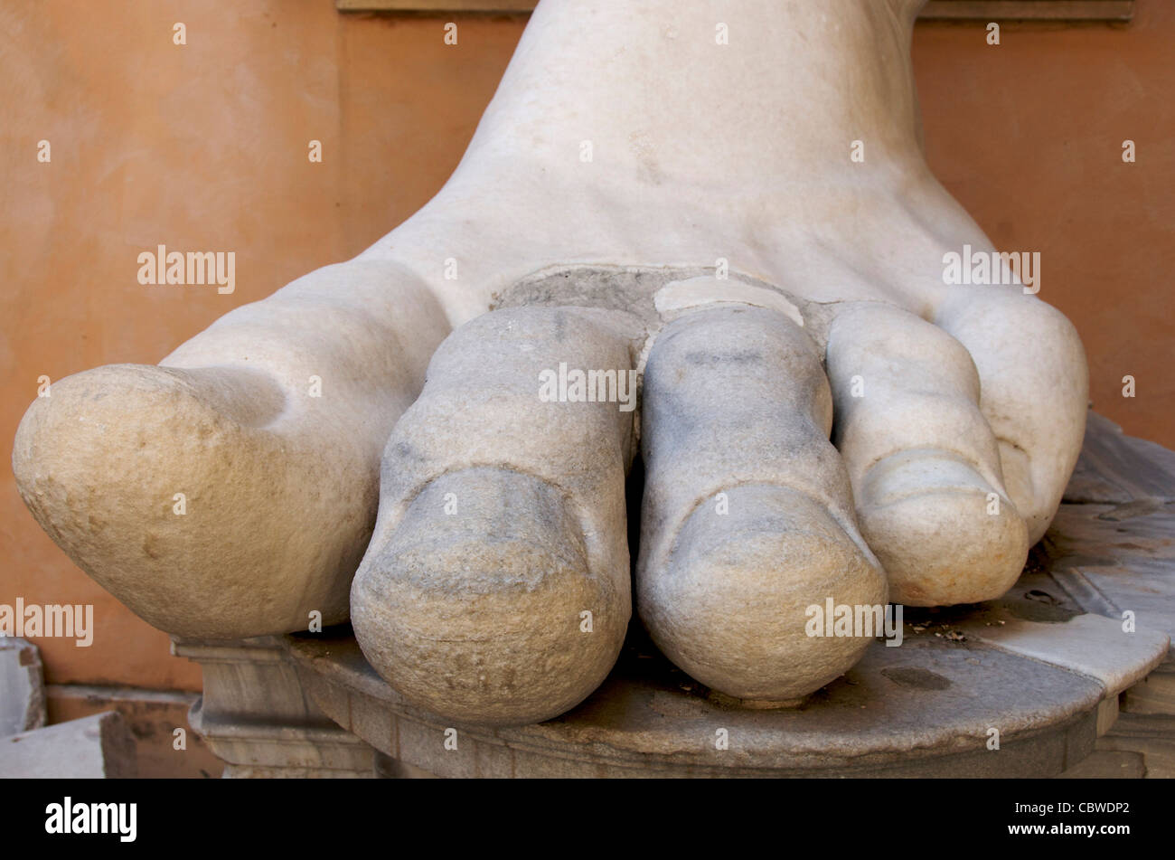 Foot of the gigantic statue of Emperor Constantine in the Palazzo dei Conservatori at Capitoline Museums, Rome, Italy Stock Photo