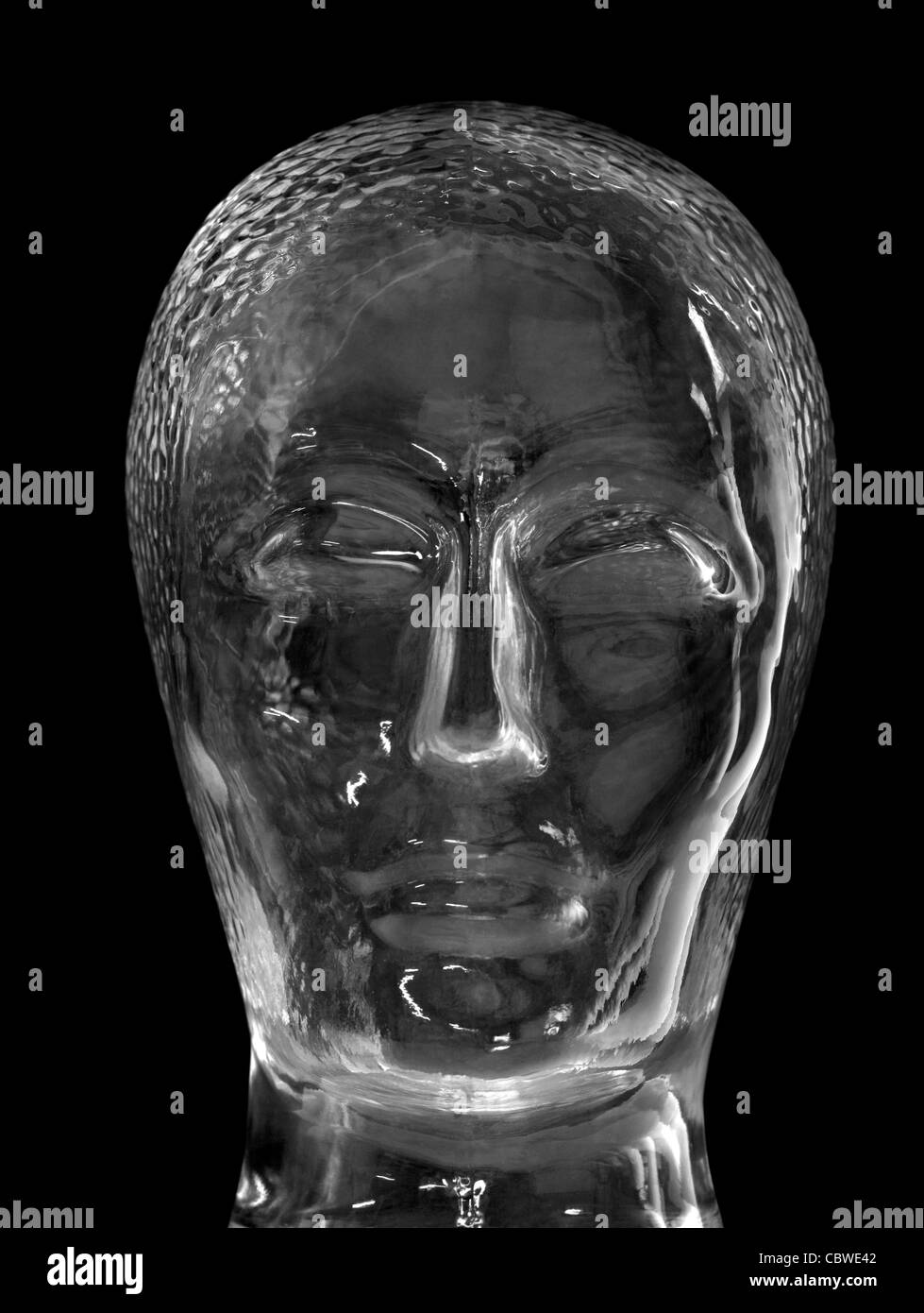 human head made of glass in black back Stock Photo