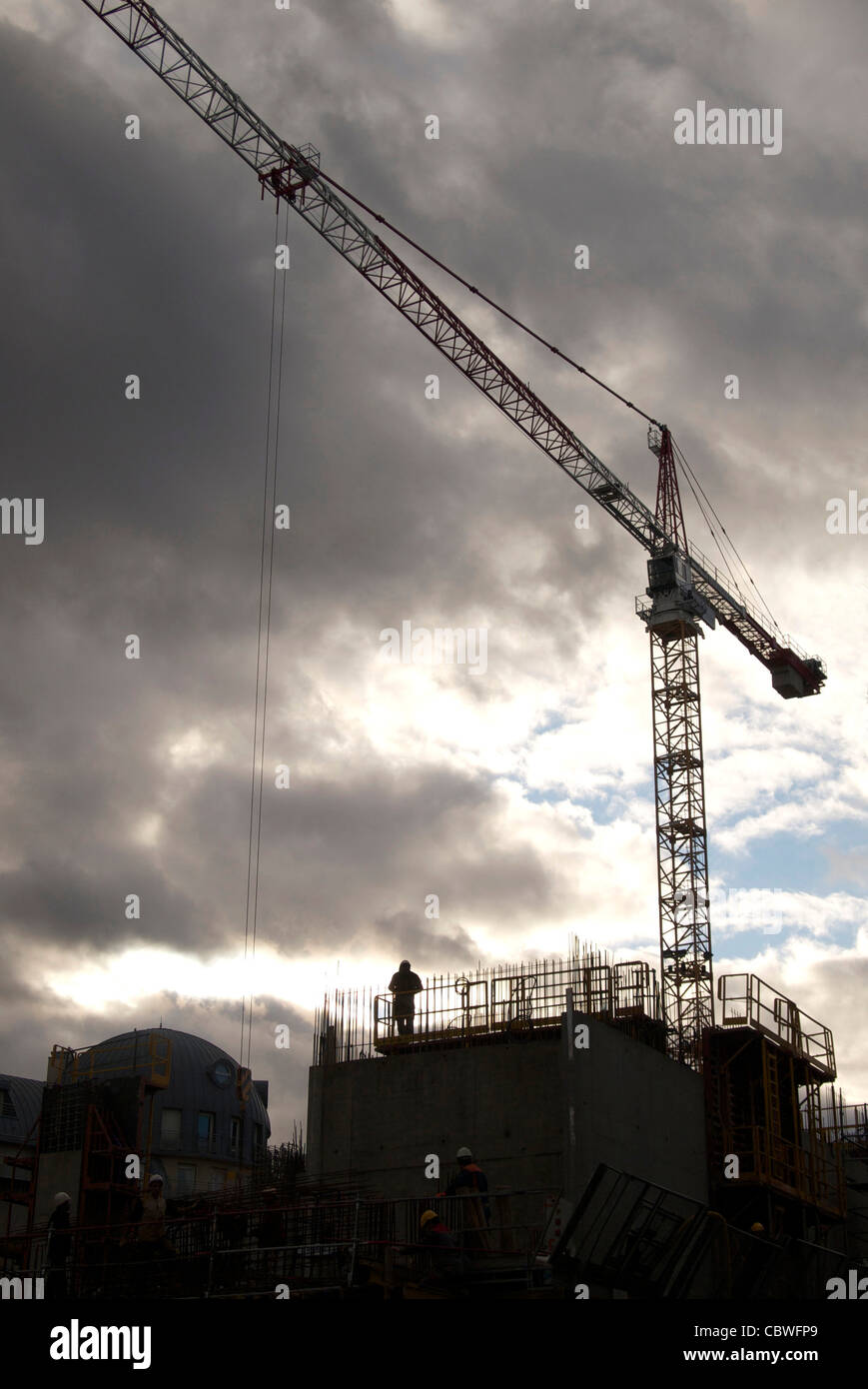 Low angle shot of a construction crane captured on a cloudy Stock Photo ...