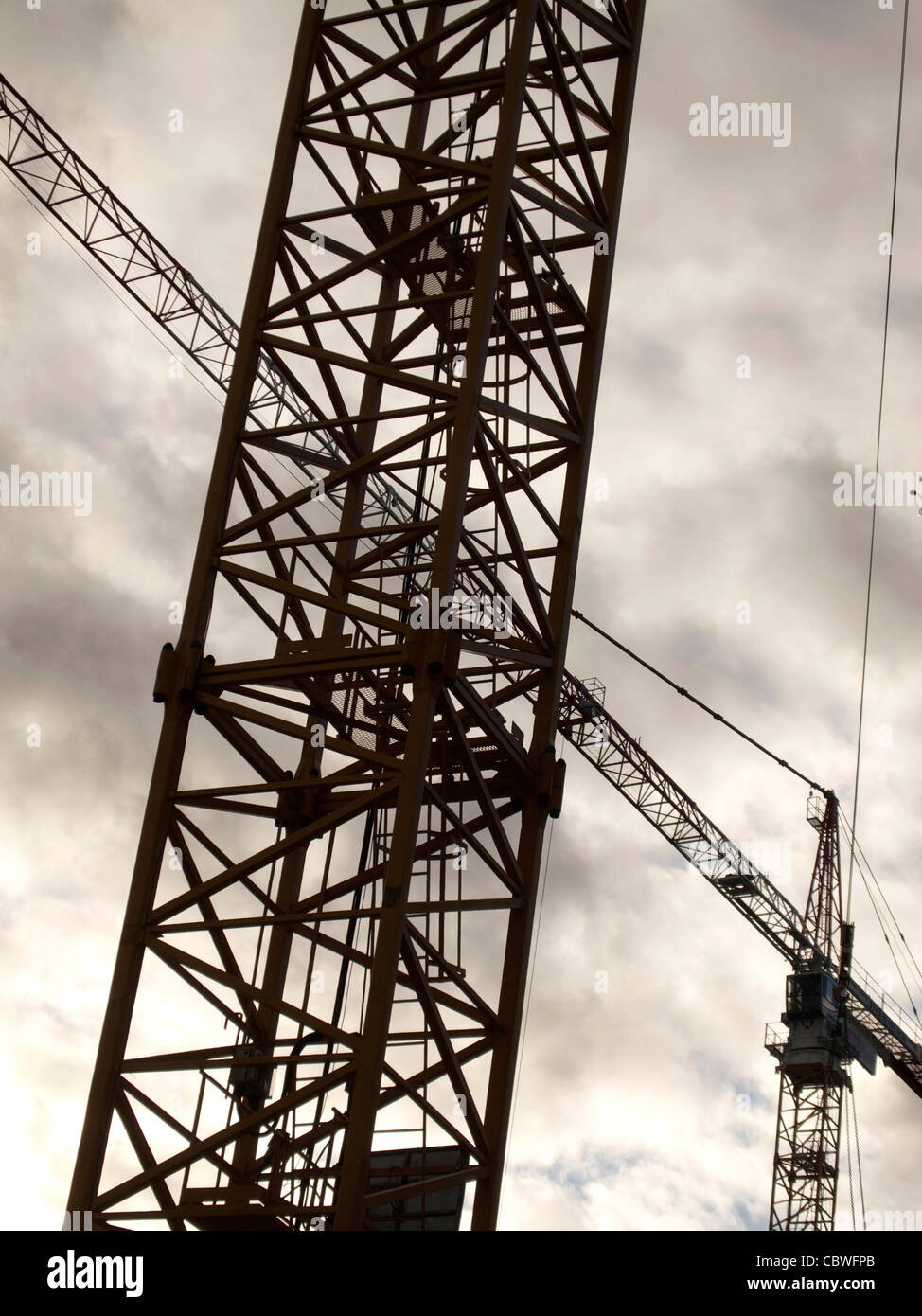 Low angle shot of a construction crane captured on a cloudy Stock Photo