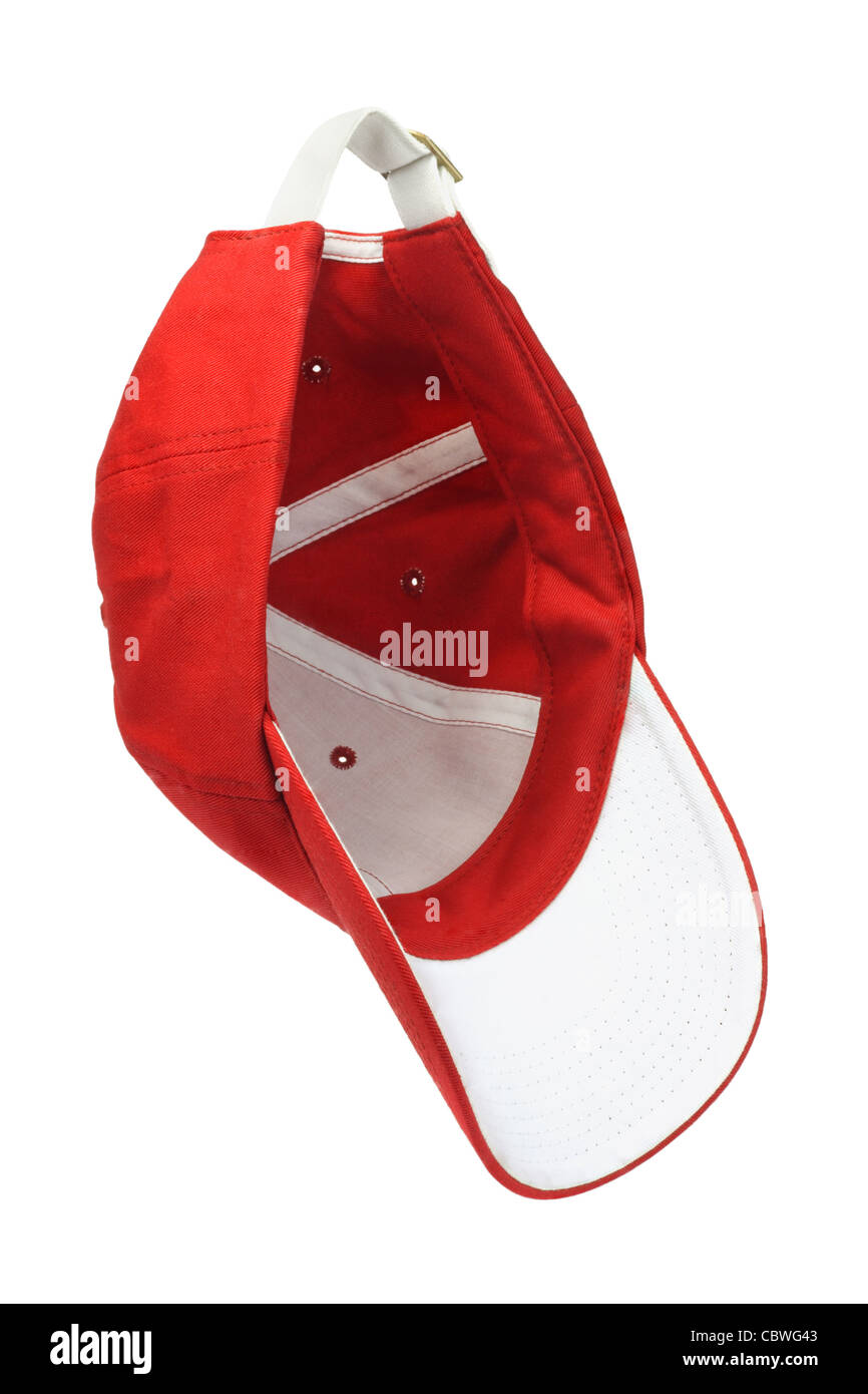 Red baseball cap hanging in the air on white background Stock Photo