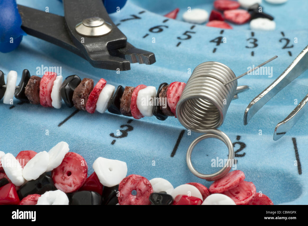 Seen here is a close up of jewelry making and jewelry making equipment Stock Photo