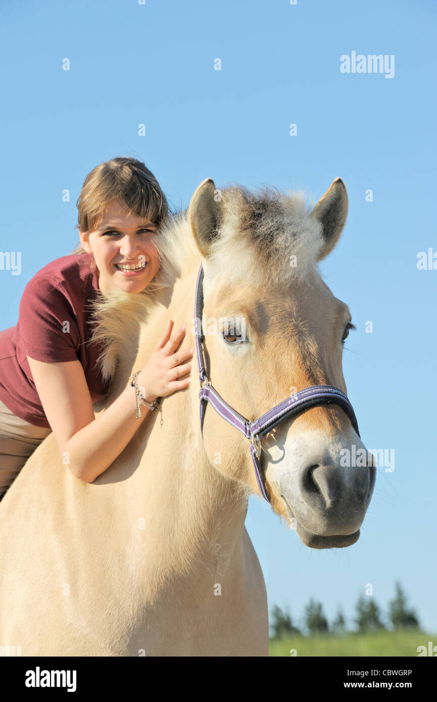 Girl on Norwegian horse Stock Photo Alamy