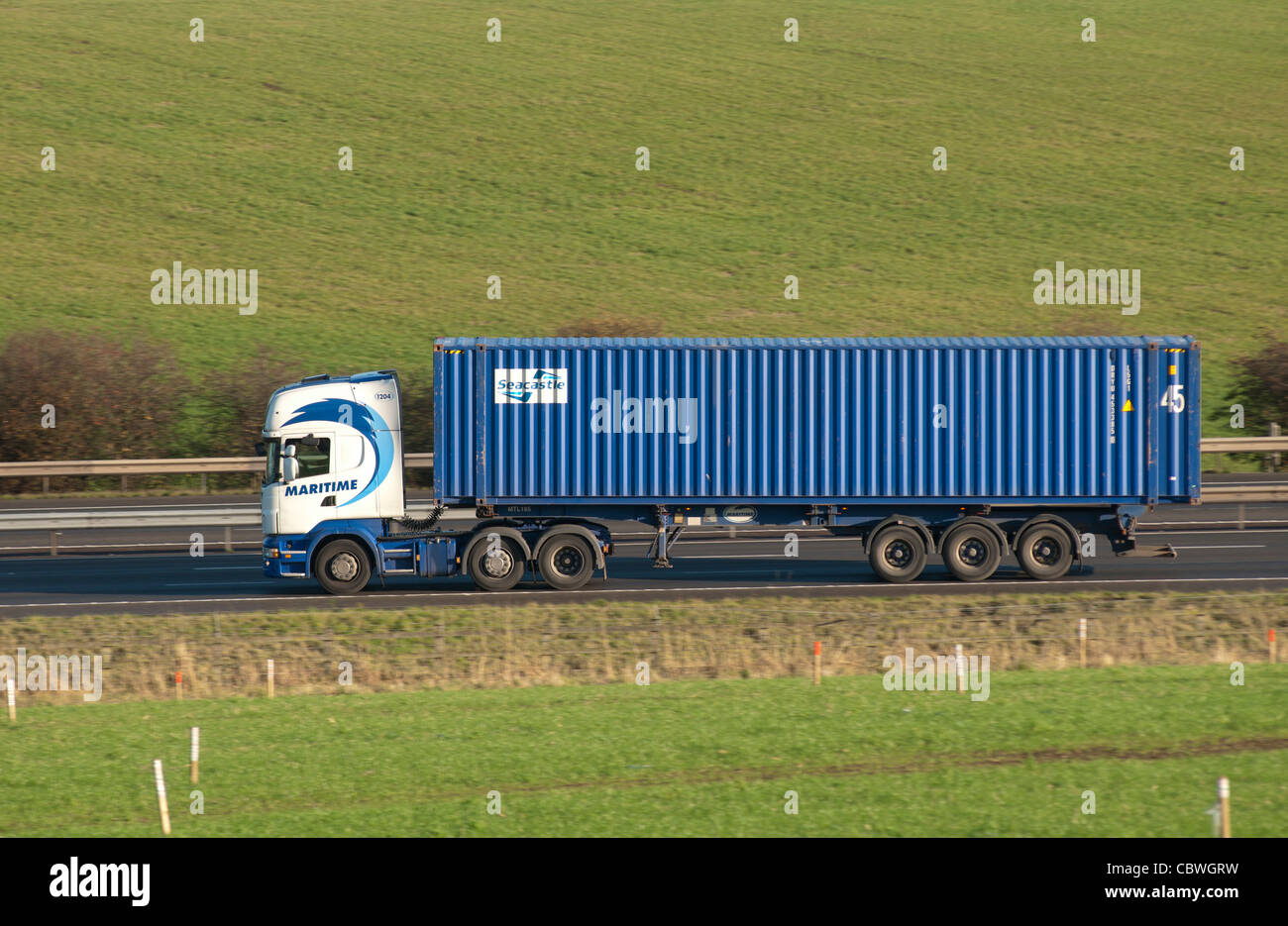 Maritime shipping container lorry on M40 motorway, Warwickshire, UK