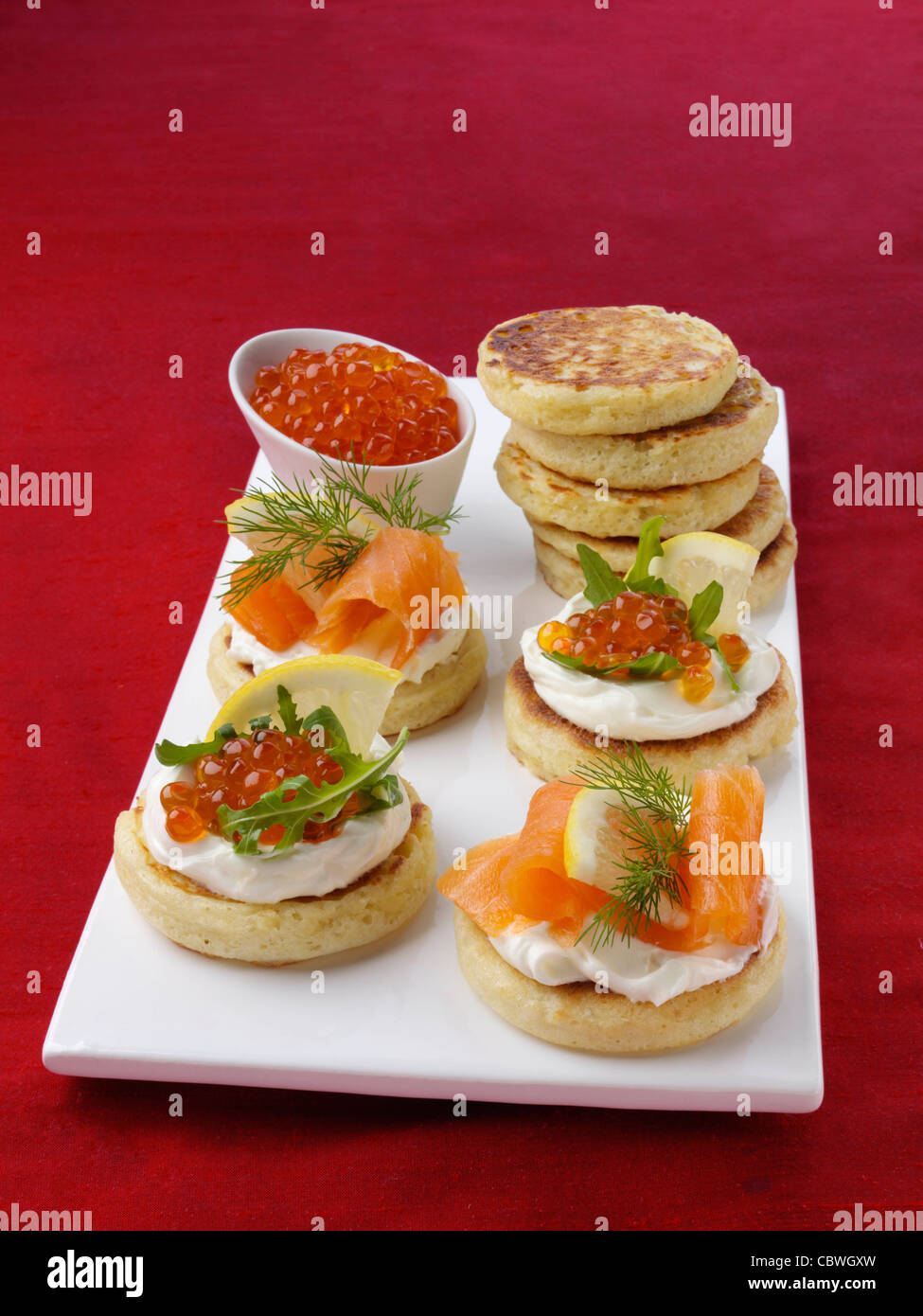 Blini with smoked salmon salmon roe and cream cheese Stock Photo - Alamy