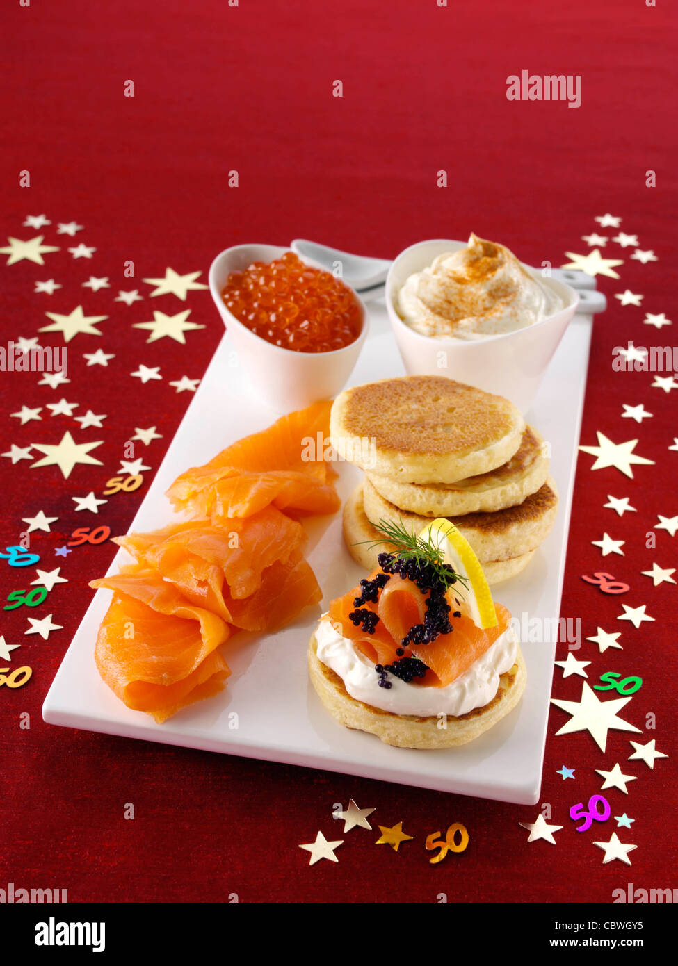 Blini with smoked salmon salmon roe and cream cheese Stock Photo - Alamy