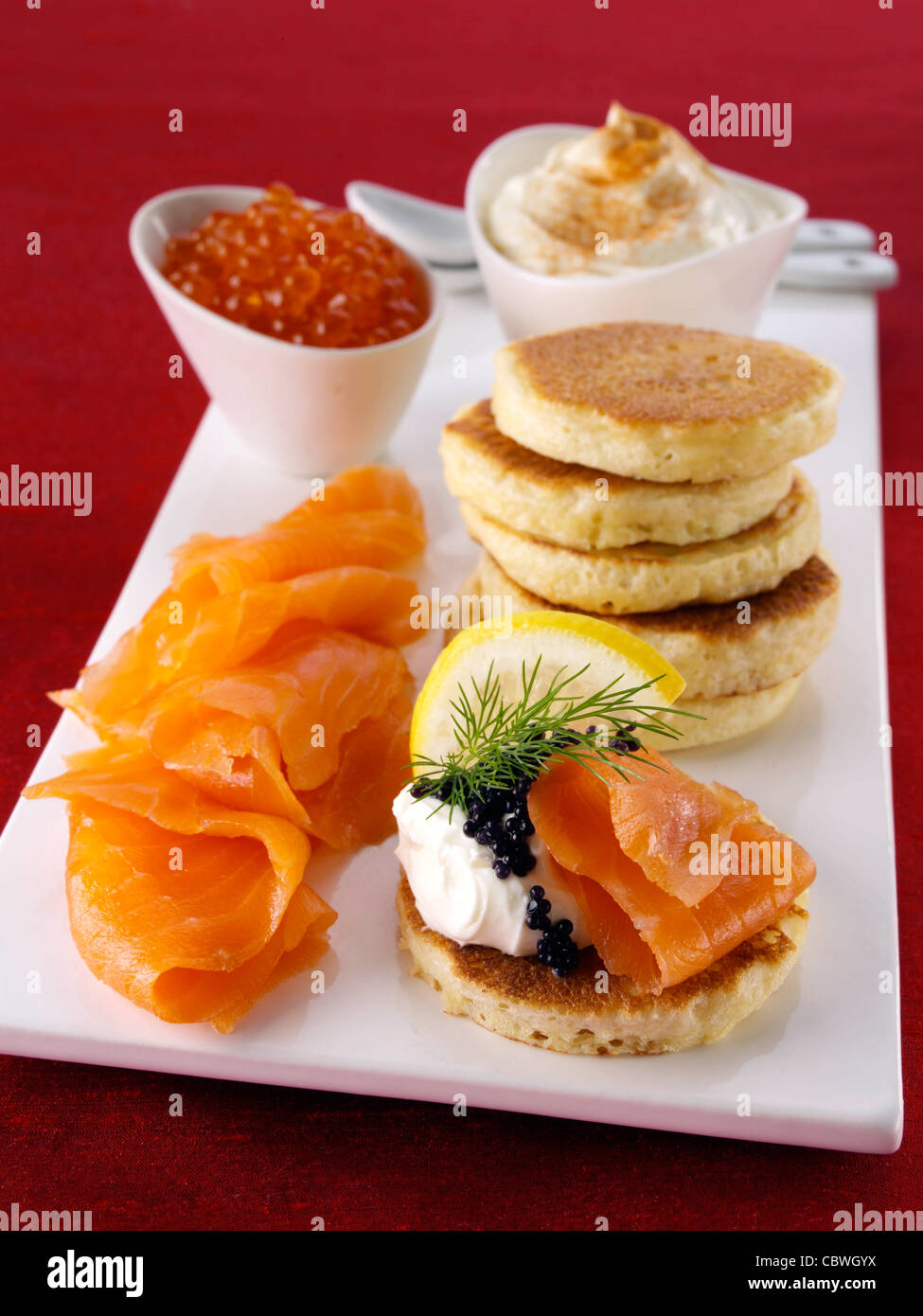 Blini with smoked salmon salmon roe and cream cheese Stock Photo - Alamy