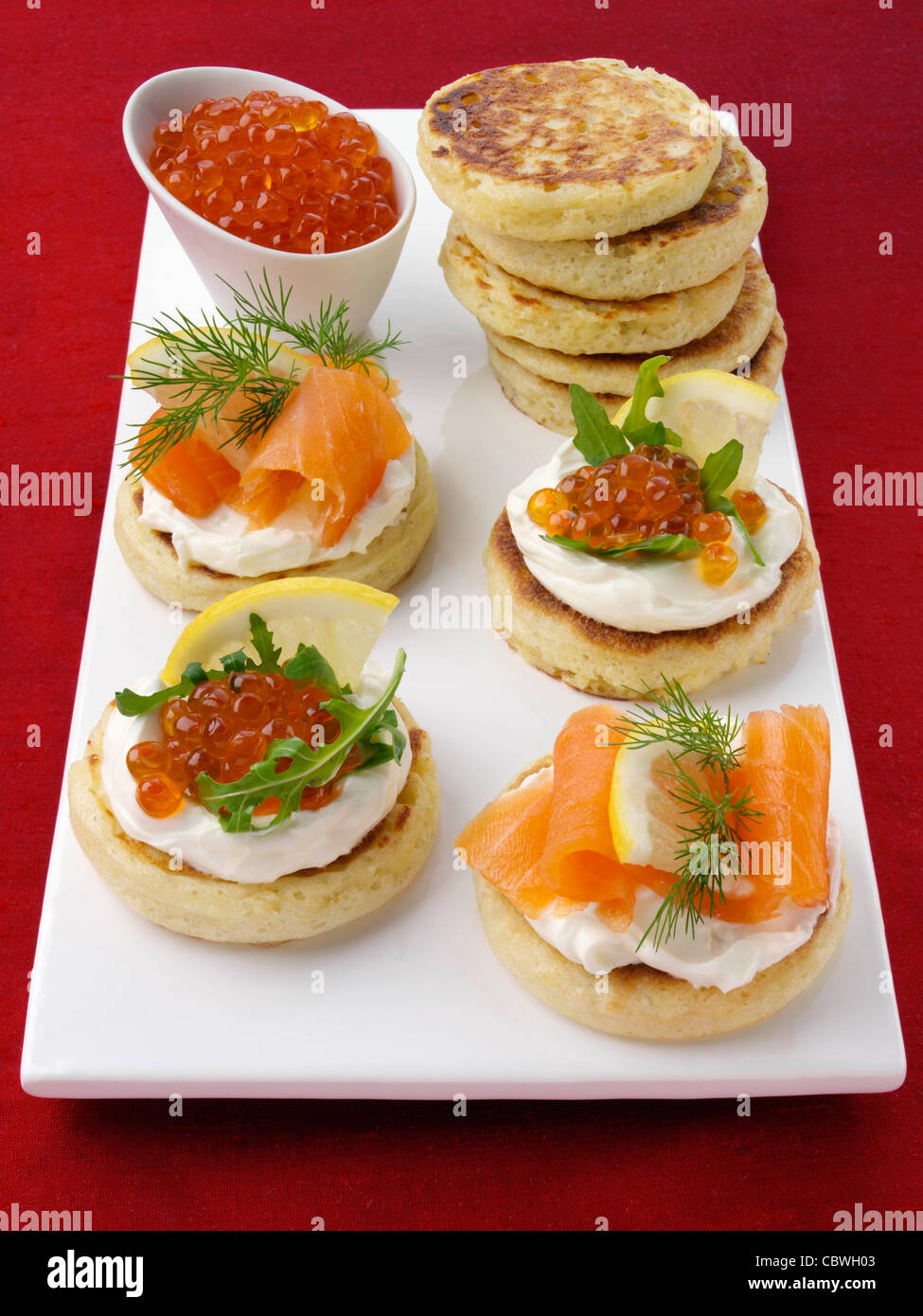 Blini with smoked salmon salmon roe and cream cheese Stock Photo - Alamy