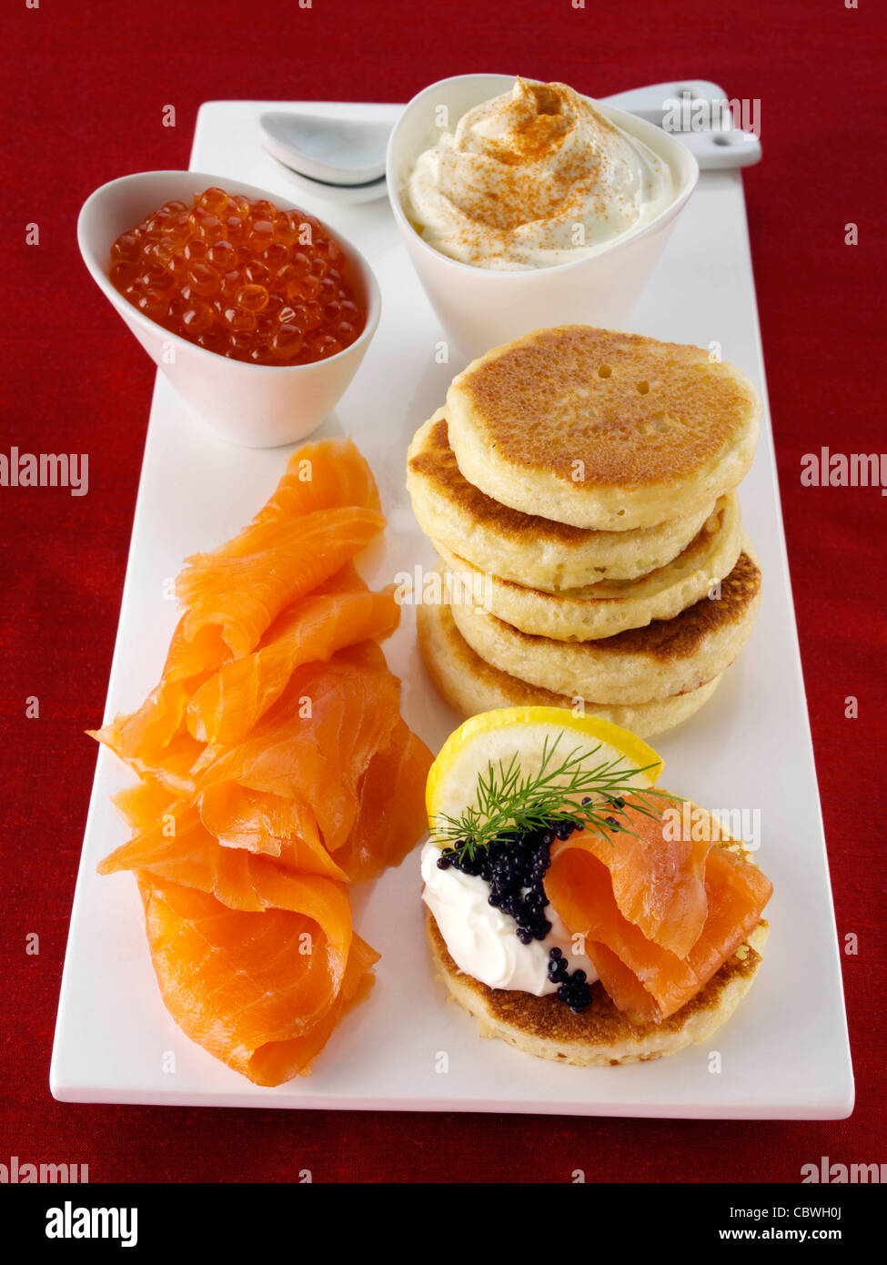 Blini with smoked salmon salmon roe and cream cheese Stock Photo - Alamy