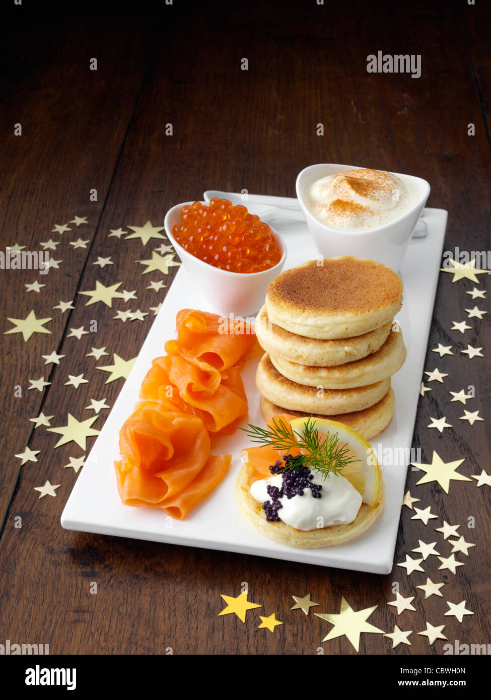 Blini with smoked salmon salmon roe and sour cream Stock Photo - Alamy