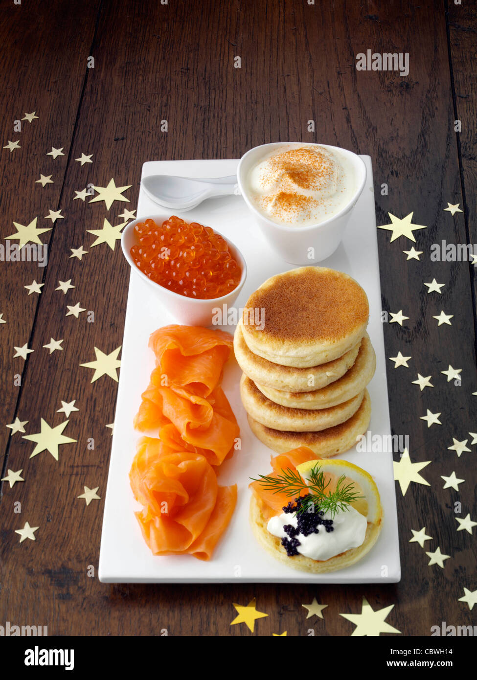 Blini with smoked salmon salmon roe and sour cream Stock Photo - Alamy