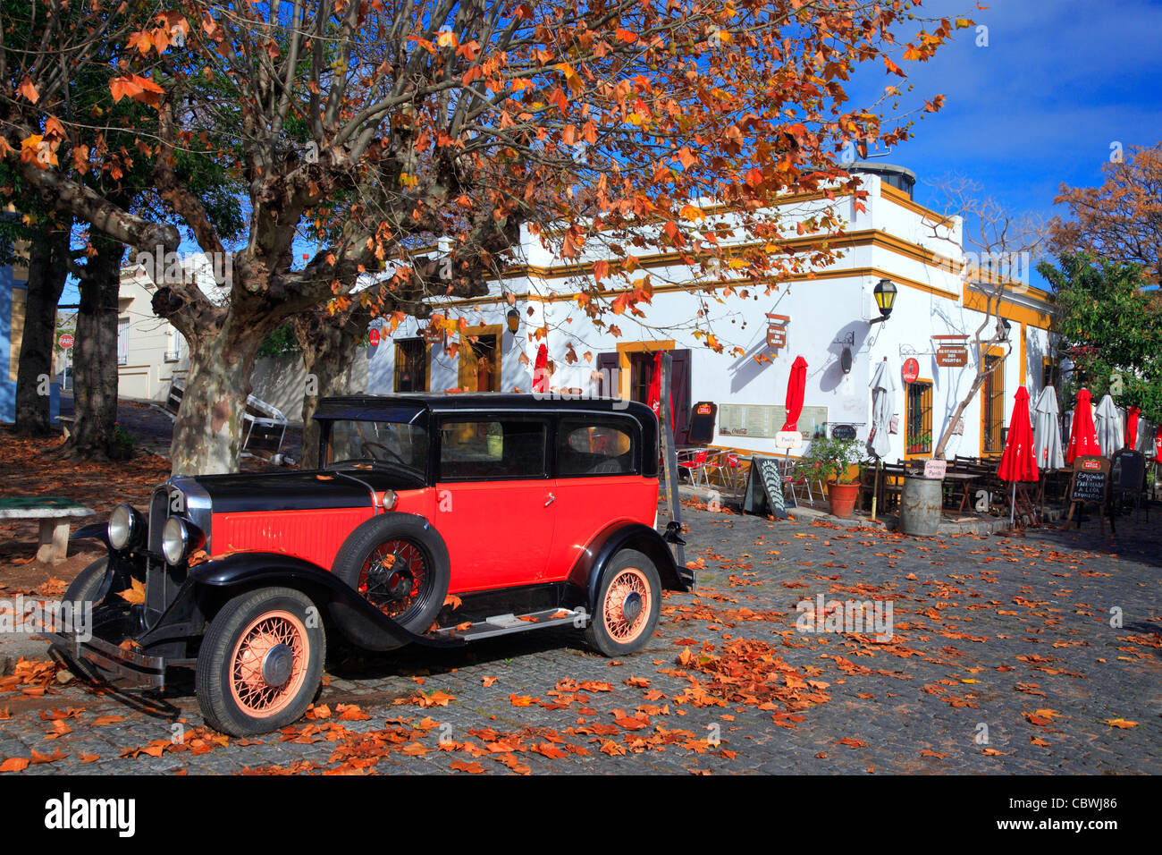 Old red and black restored antique car at Colonia del sacramento street. Uruguay, south america. Stock Photo