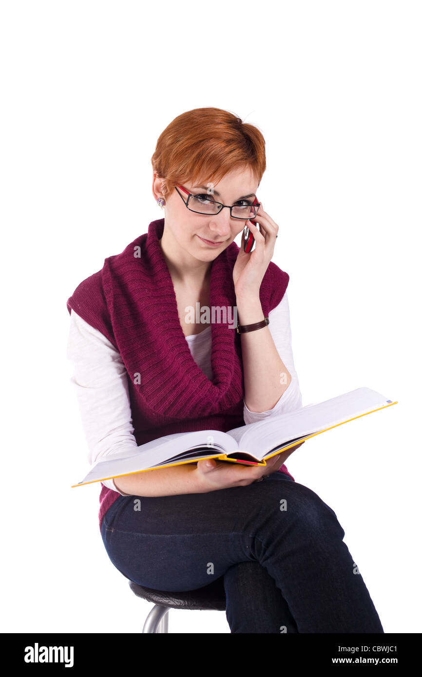girl with book is calling isolated on white background Stock Photo