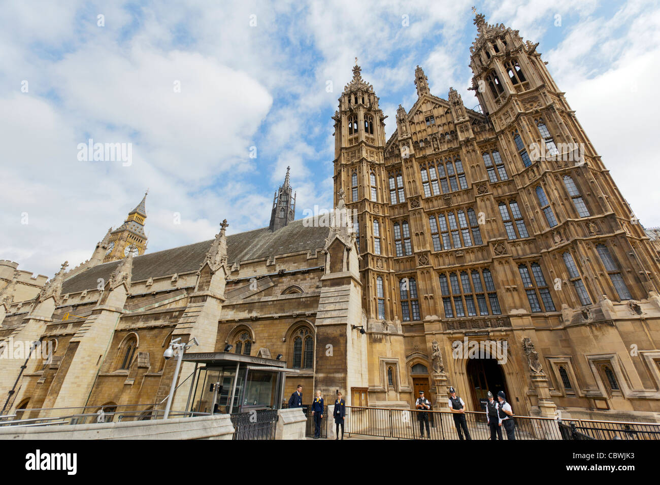 View of Houses of Parliament from Abingdon Street with police in view. Stock Photo