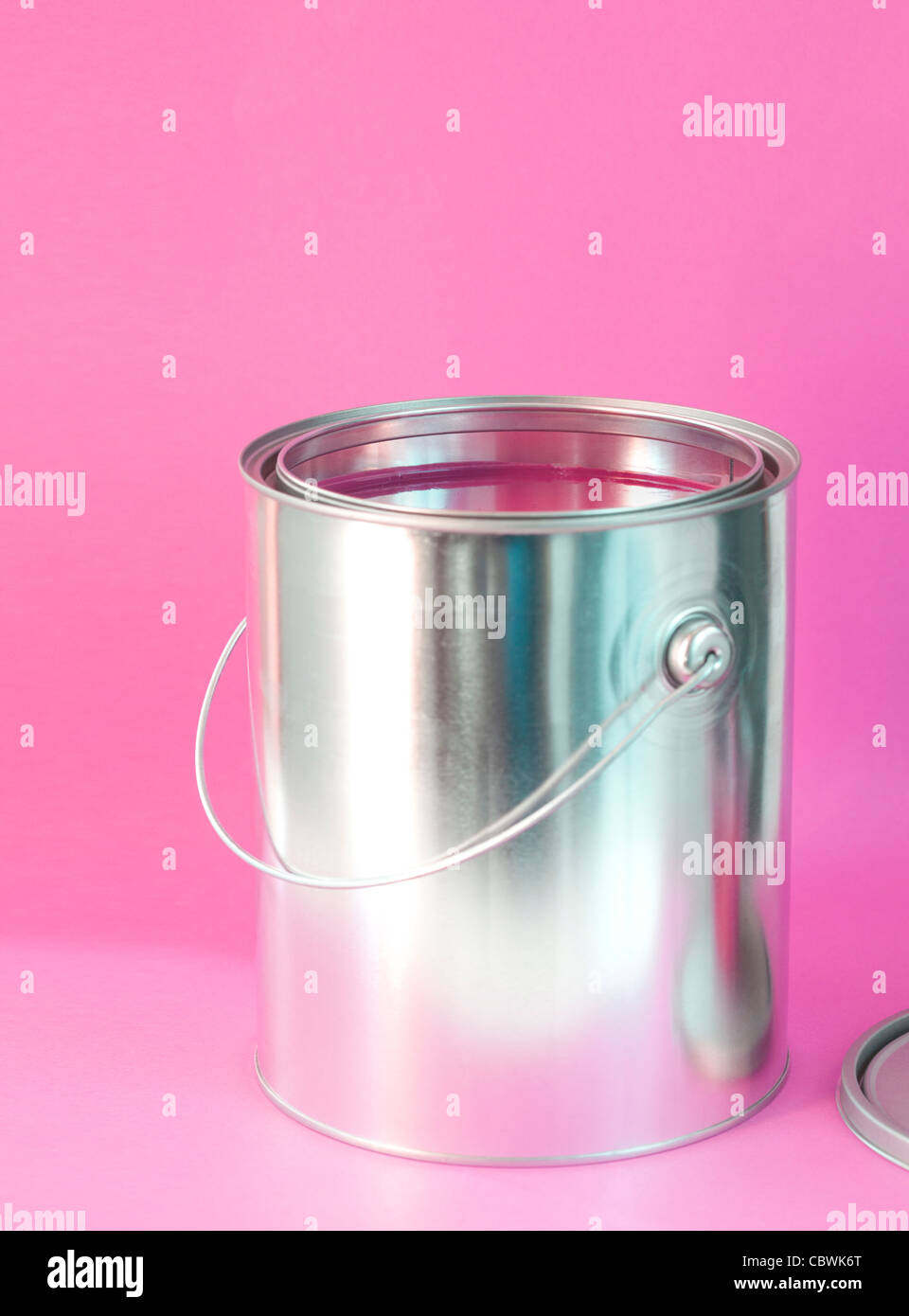 open can of pink paint Stock Photo