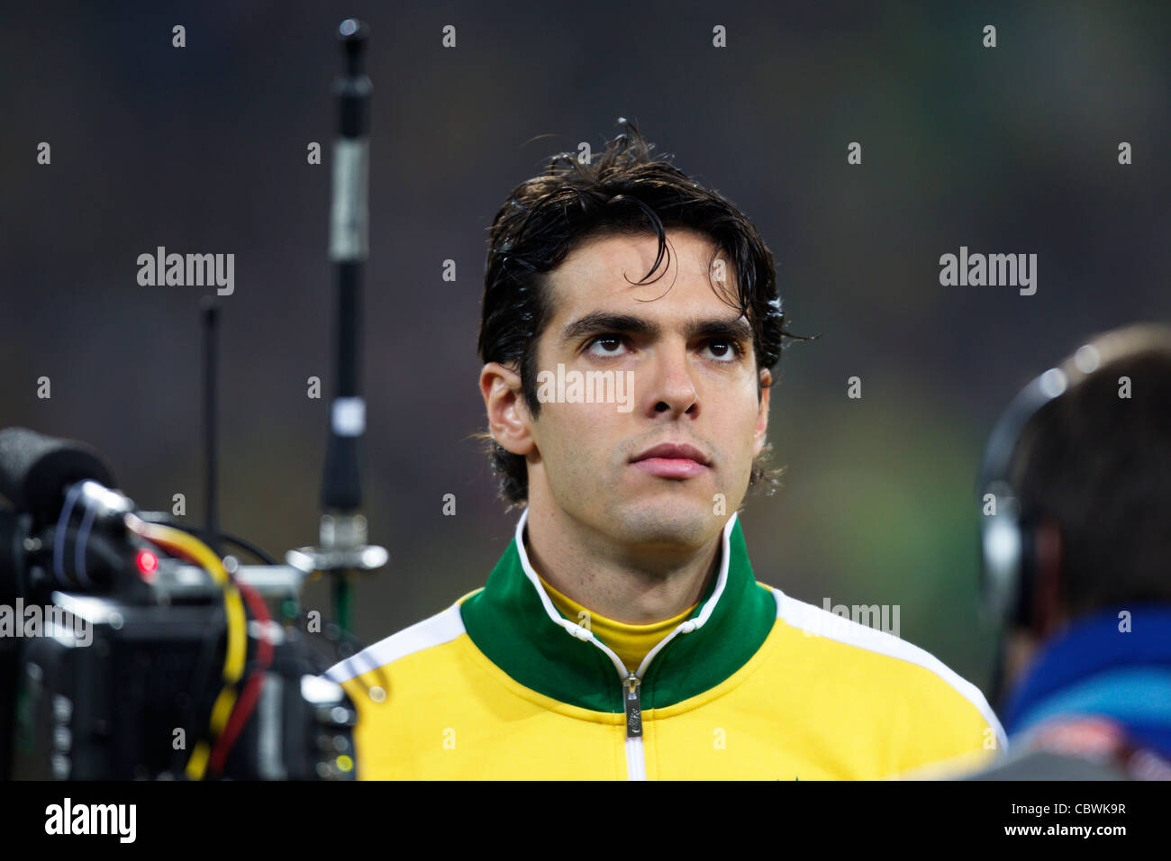Kaka of Brazil stands for team introductions before a 2010 FIFA World Cup match against Ivory Coast at Soccer City Stadium. Stock Photo