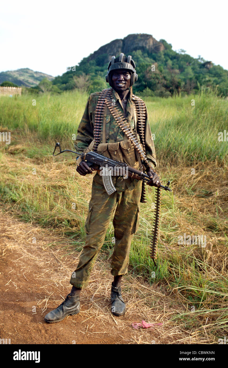 Heavily armed soldier from the Sudan People's Liberation army, Southern Sudan, Africa Stock Photo
