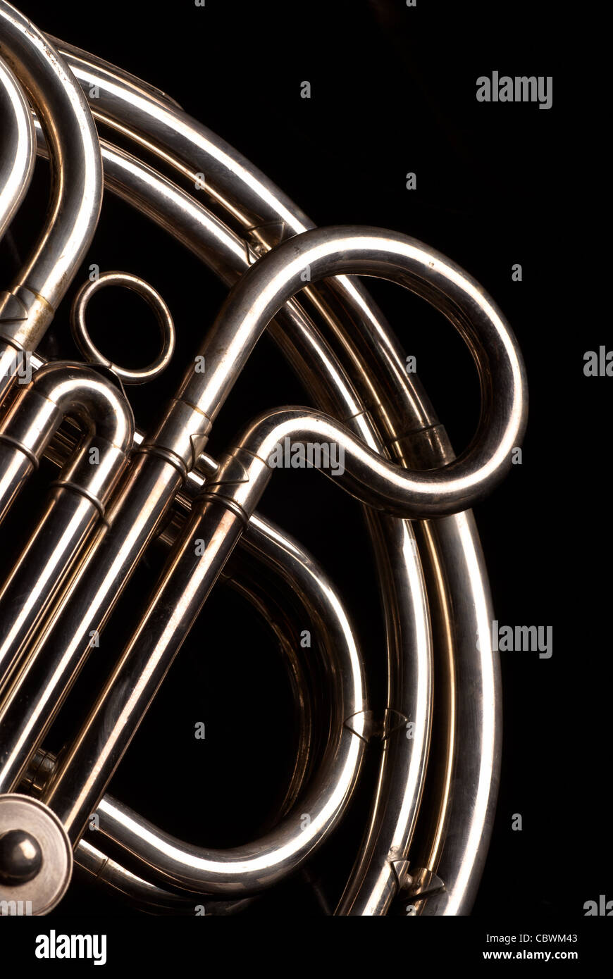Detail of the coiled pipes of a French horn Stock Photo Alamy