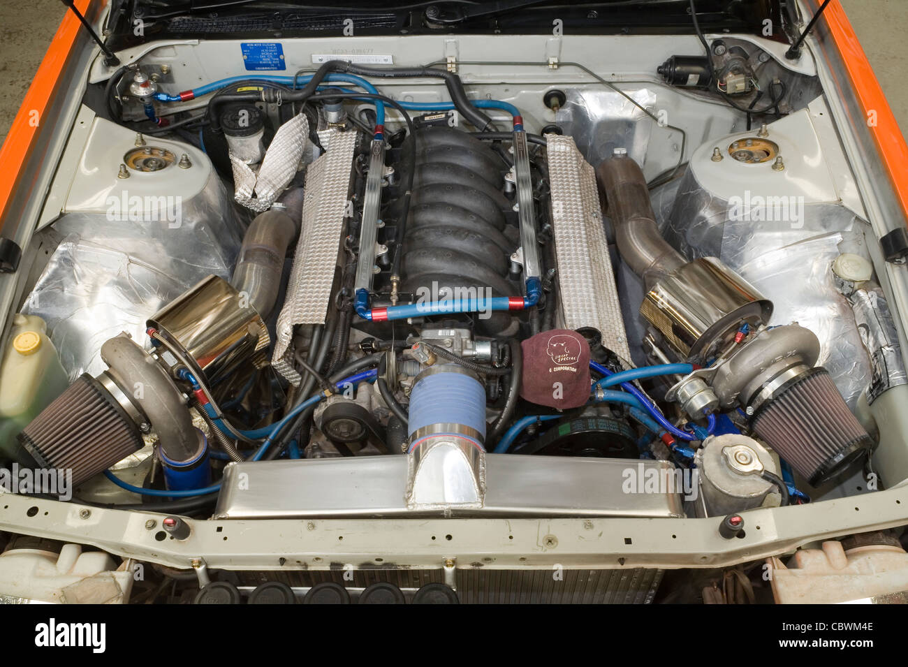 Two twin turbo turbochargers on a heavily modified Chevrolet Vee V 8 eight LS1 engine Stock Photo