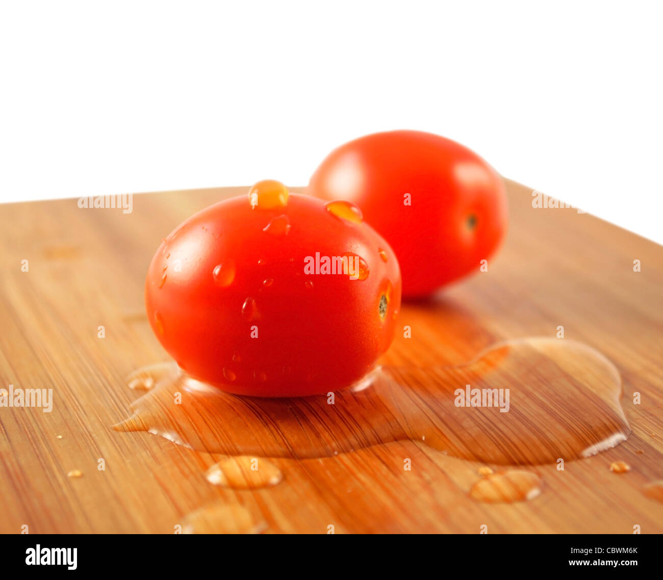 small cherry tomatoes on a cutting board Stock Photo - Alamy