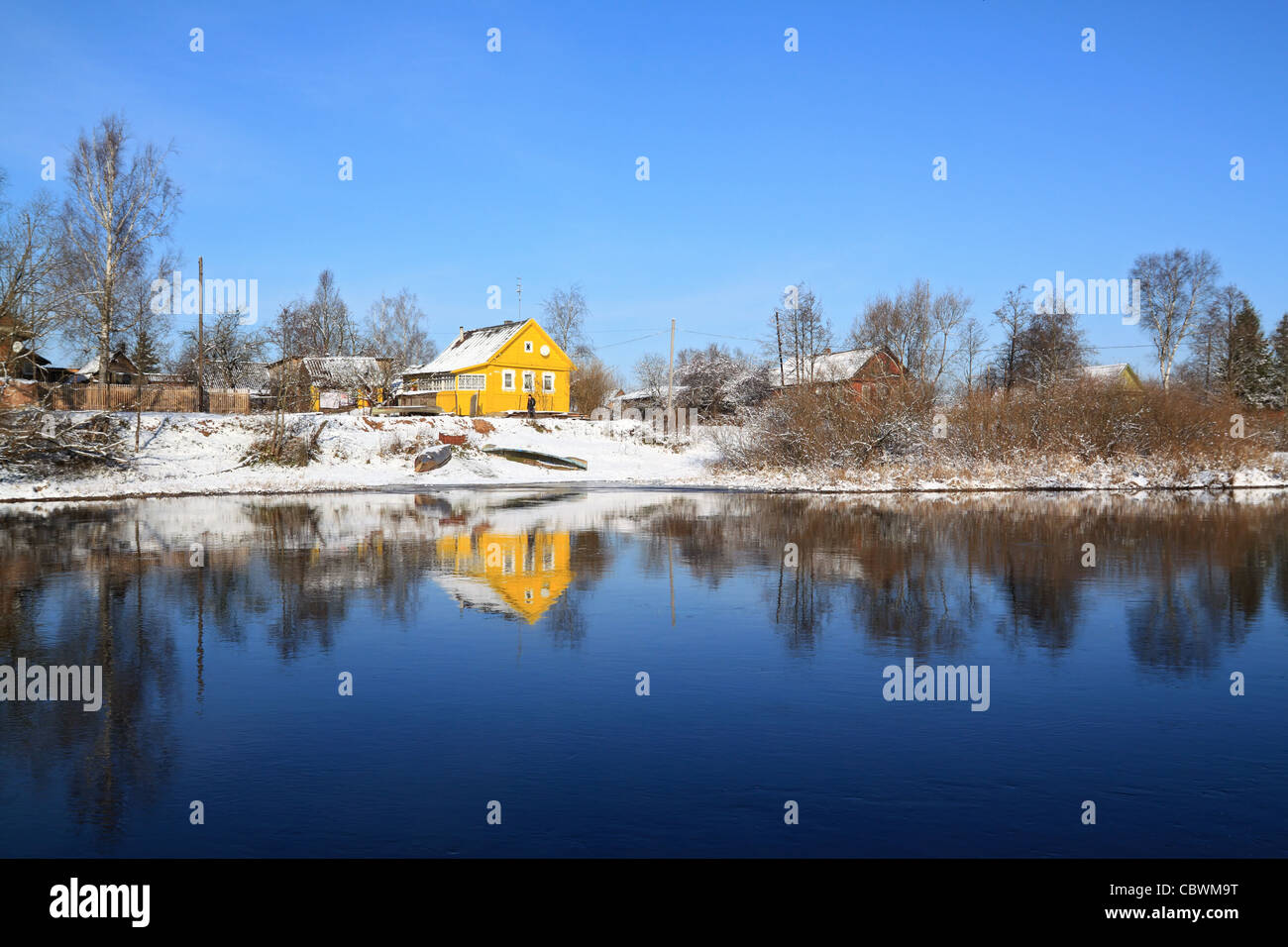 yellow house on coast river Stock Photo Alamy