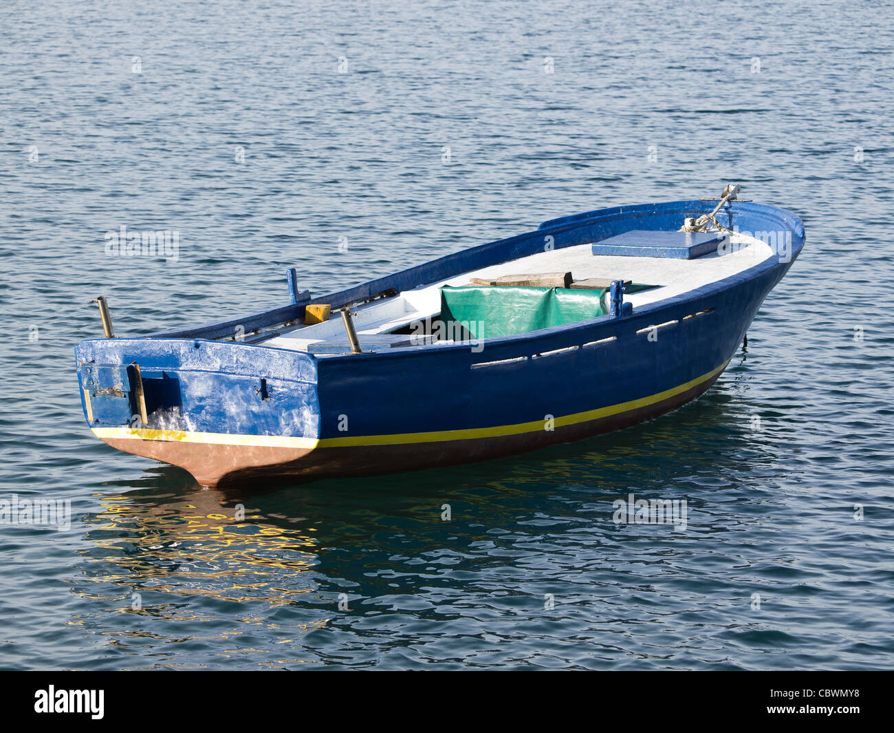 old wooden blue boat on the sea Stock Photo - Alamy