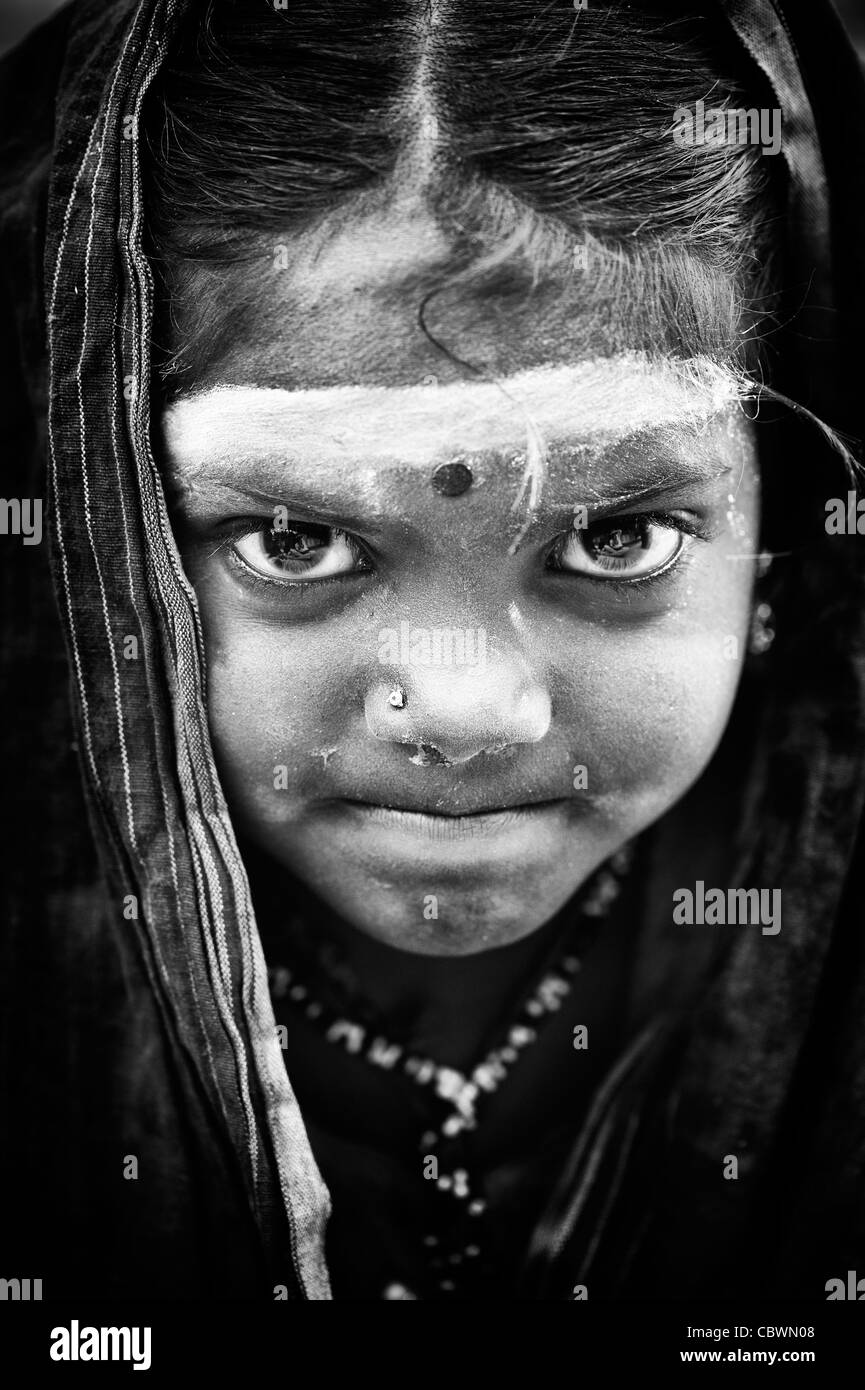 Poor Indian beggar girl. Monochrome Stock Photo