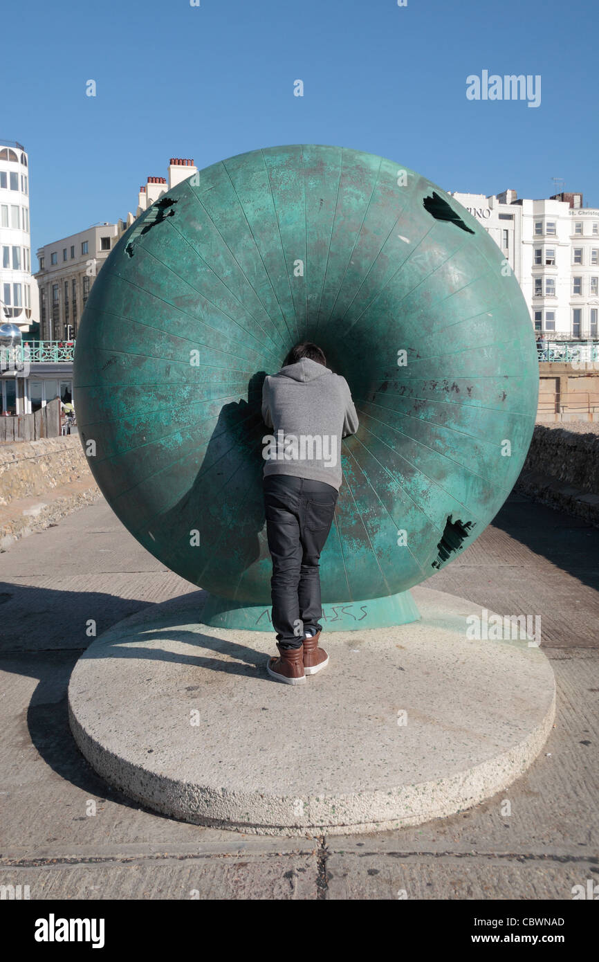 A gift from the Mayor of Naples, The Big Green Bagel (known locally as the "Seasick Doughnut"), on Brighton seafront, UK. Stock Photo