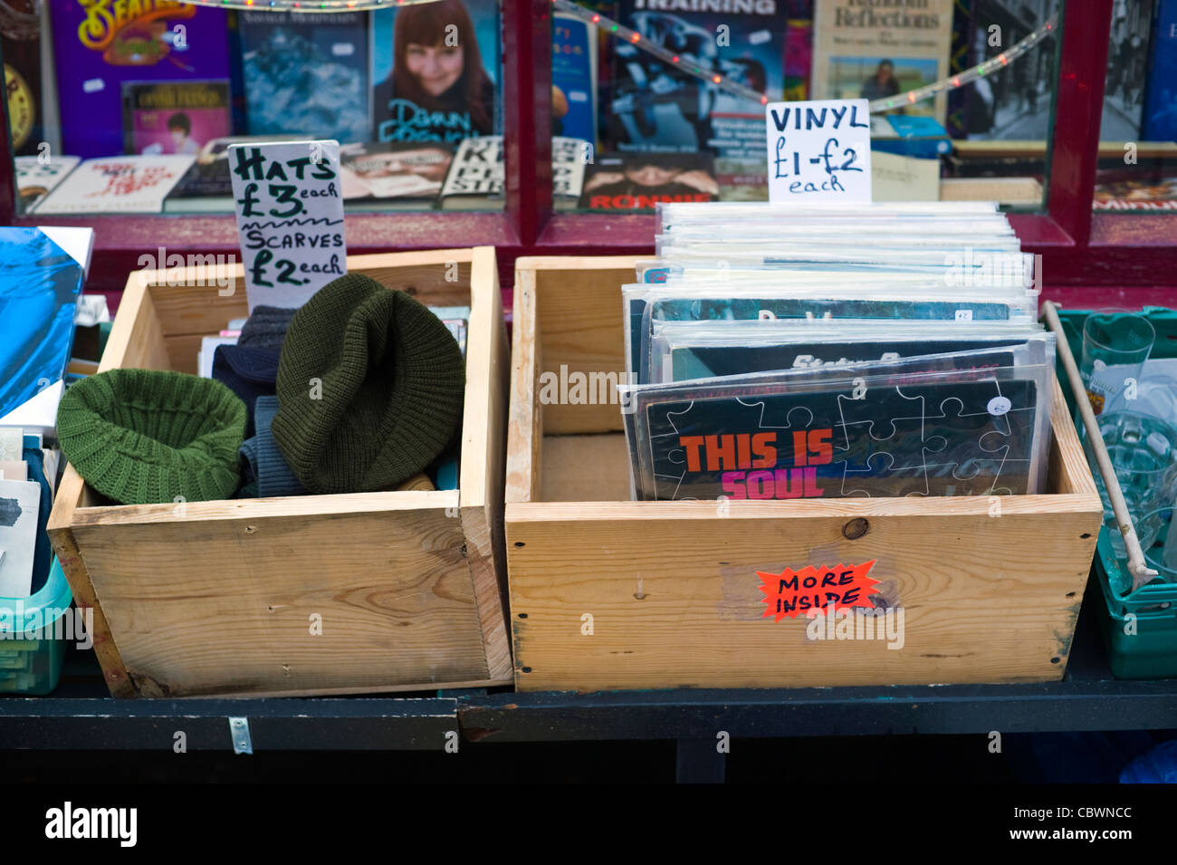 Cheap bargain box of hats scarfs and vinyl LPs for sale outside shop in  Hay-on-Wye Powys Wales UK Stock Photo - Alamy