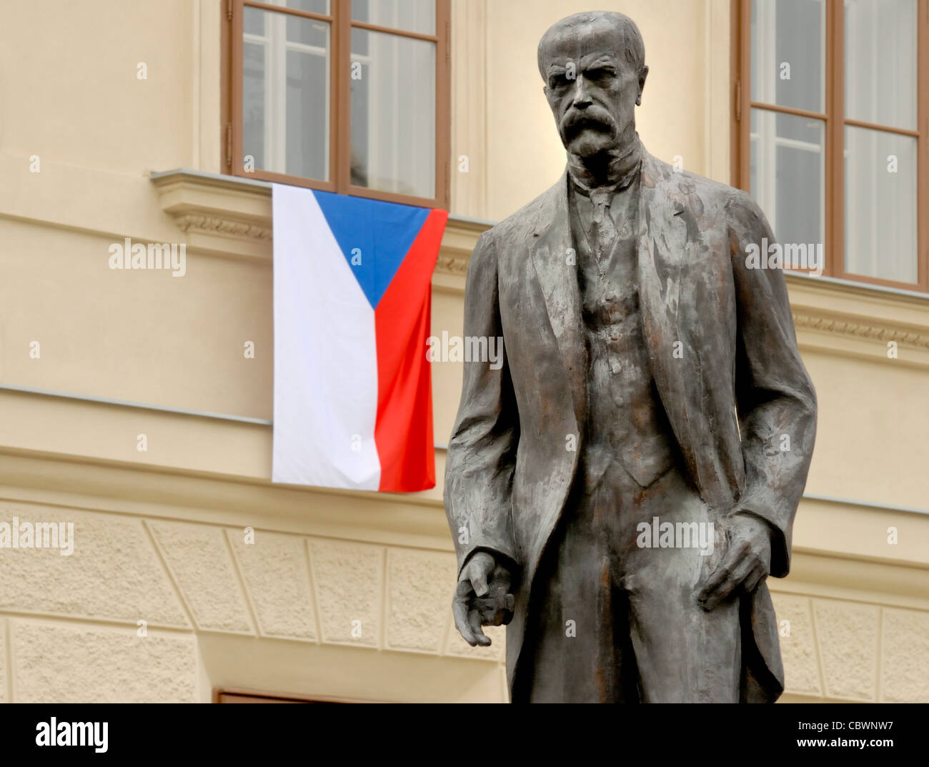 Prague, Czech Republic. T G Masaryk (first president of Czechoslovakia) in Hradcanske namesti (Castle Square) with Czech flag Stock Photo