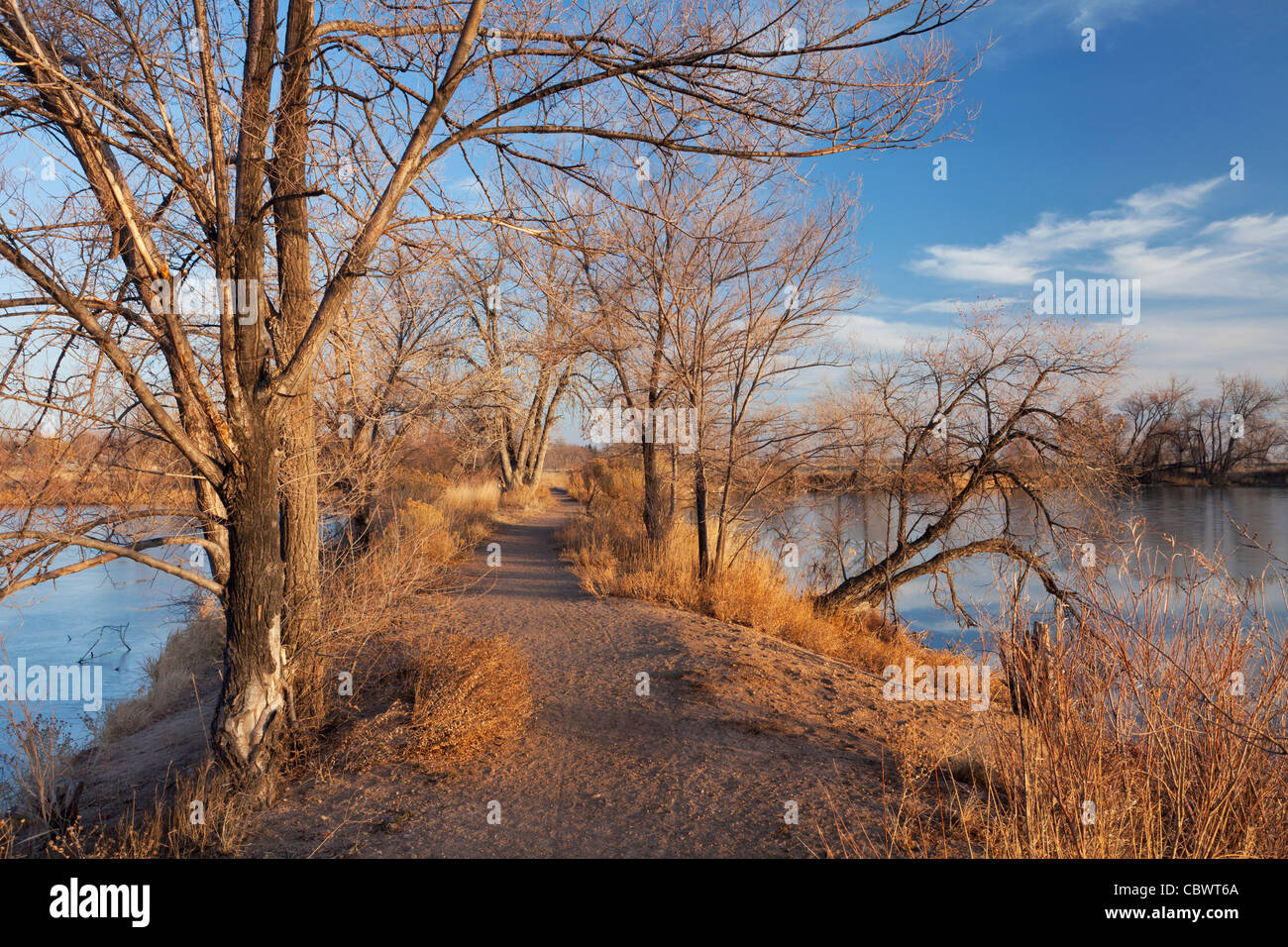 pathway on a narrow dike between lakes, late fall or winter scenery