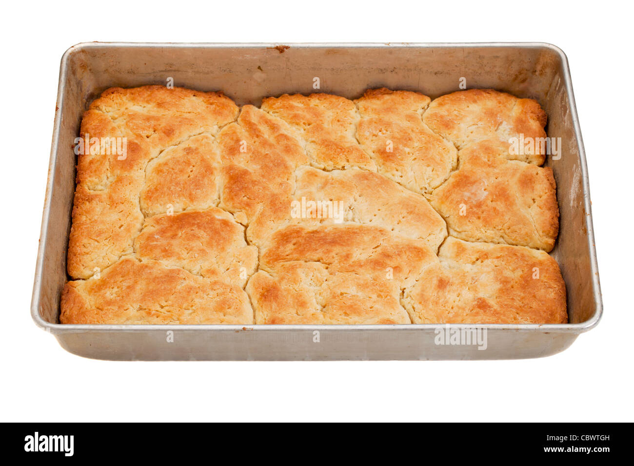 freshly baked pie (base layer) in a metal baking tray, isolated on white Stock Photo