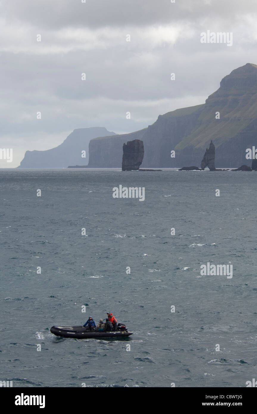 Denmark, Faroe Islands, North Atlantic. Island of Streymoy, exploring the rocky cliffs of Vestmanna by zodiac boat. Stock Photo