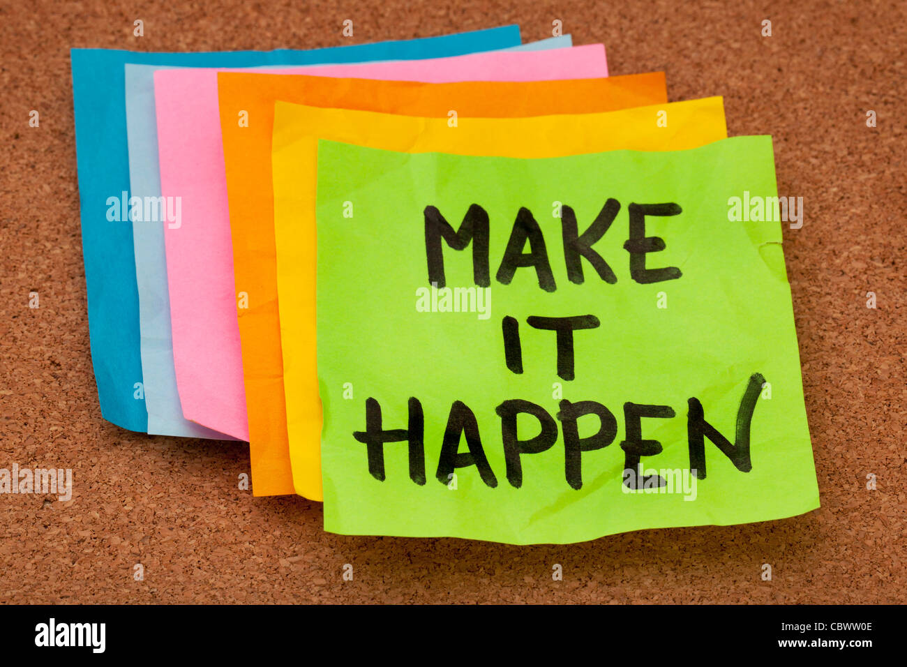 make it happen, motivational slogan, colorful sticky notes on cork