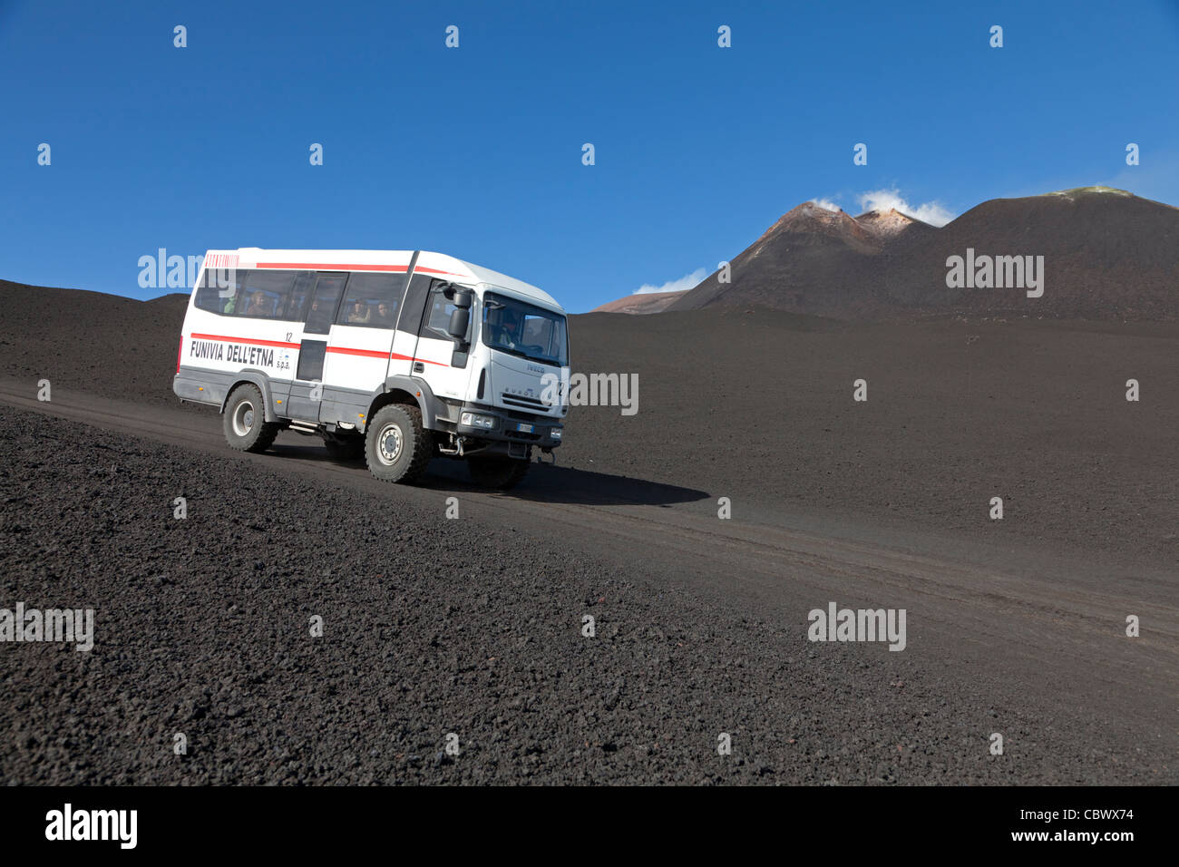 Tourist bus with Mount Etna, Sicily, Italy Stock Photo