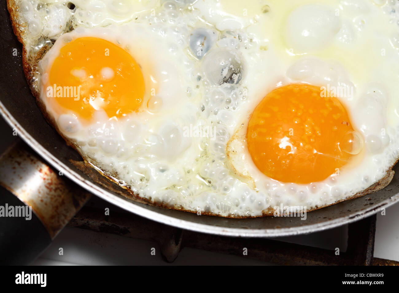pan full of scramble eggs in a frying pan Stock Photo Alamy