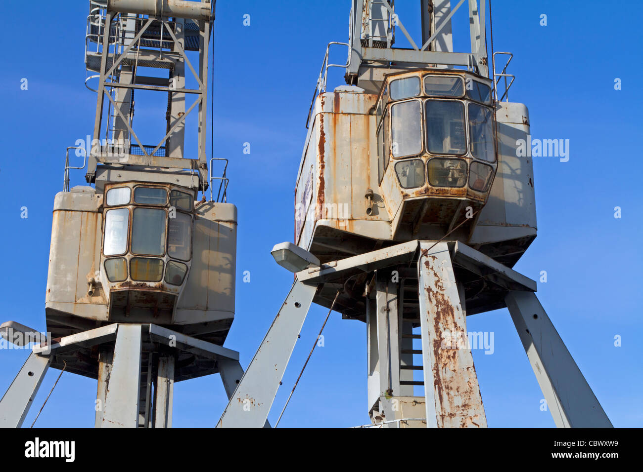 Old loading cranes at Hamburg harbor, Germany Stock Photo