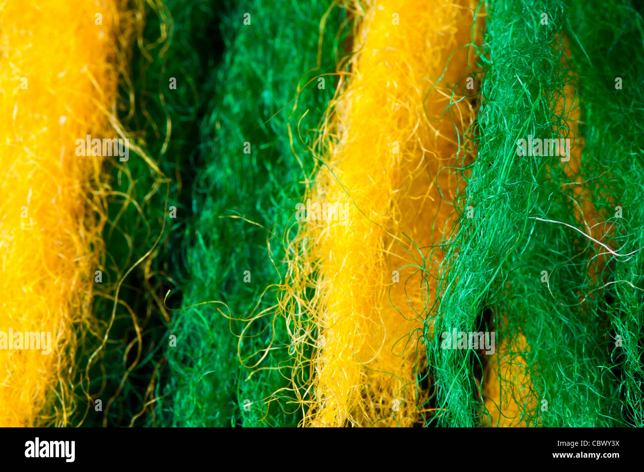 Green and yellow wool fibers closeup Stock Photo - Alamy
