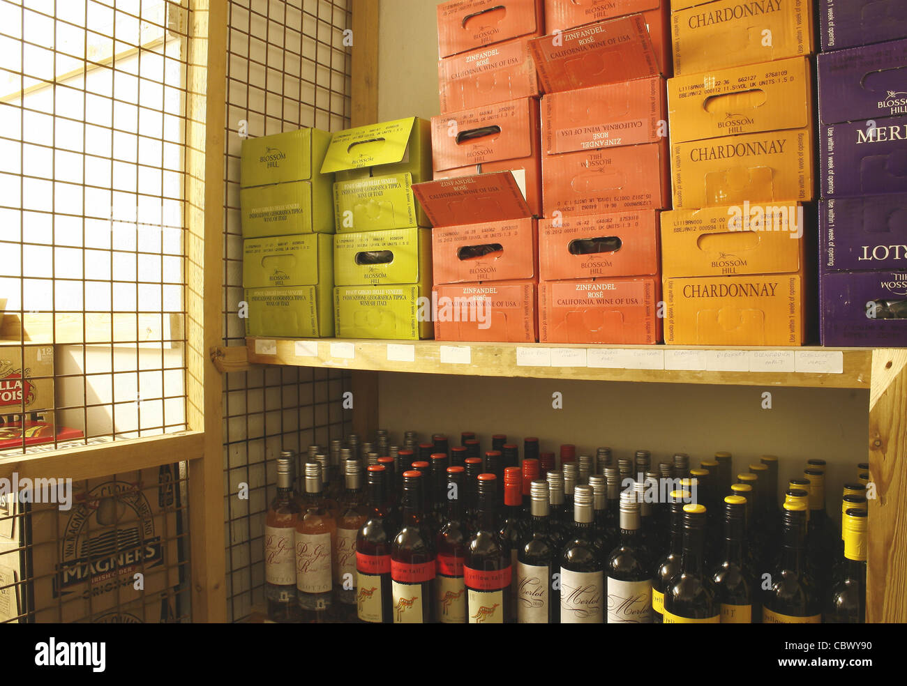 cases of drinks in bottle store of pub Stock Photo Alamy