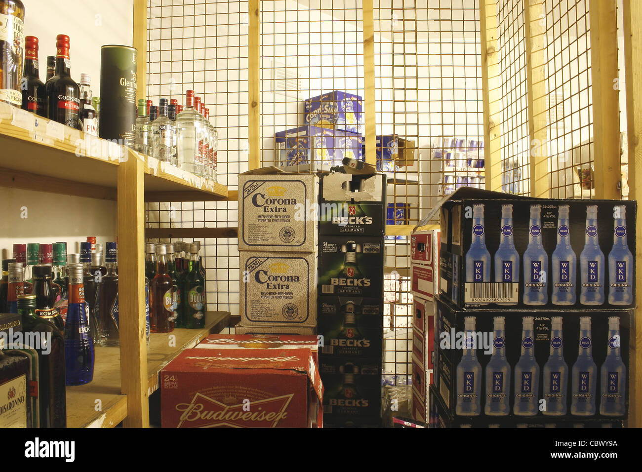 cases of drinks in bottle store of pub Stock Photo