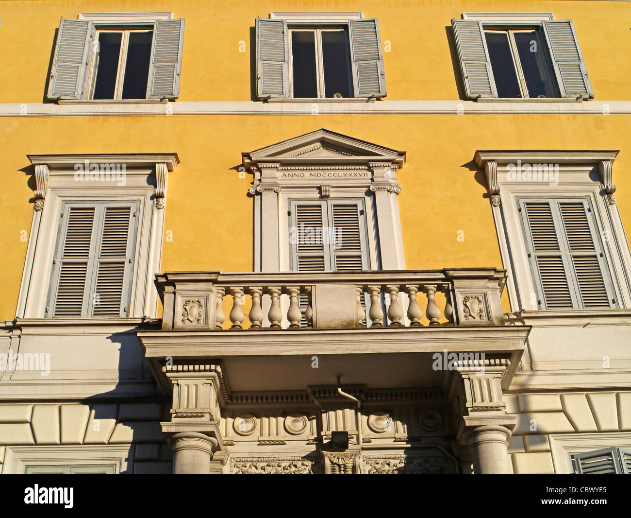 Rome, apartment building facade with ornate balcony Stock Photo