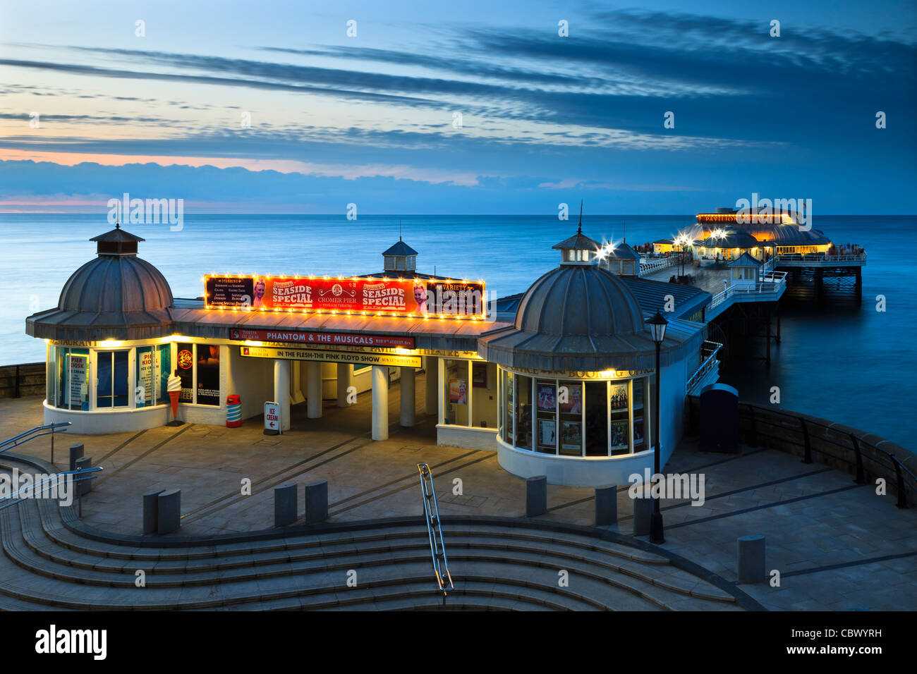 Lights on at Cromer Pier on a summers evening at sunset Stock Photo Alamy